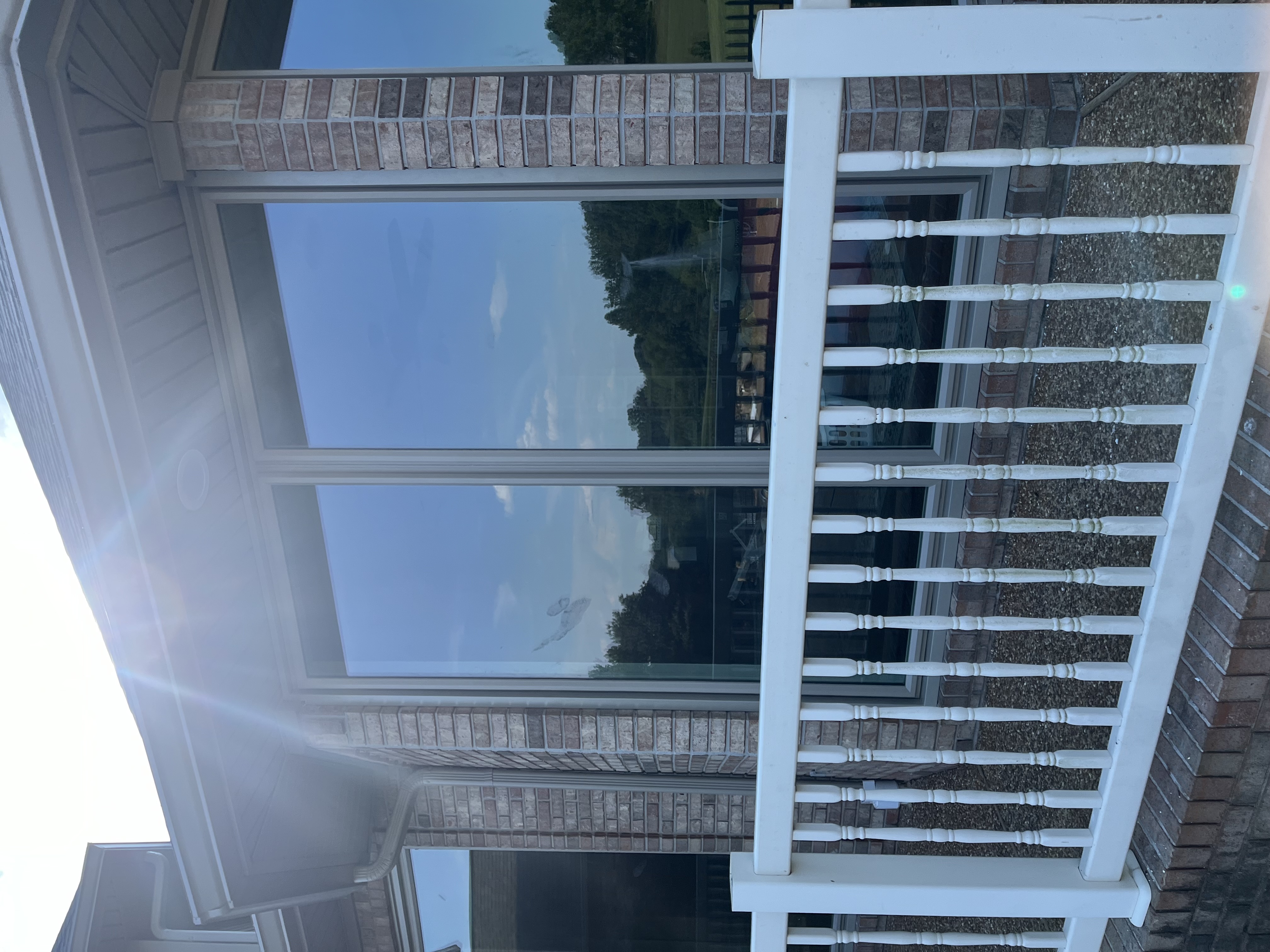 large custom windows and porch railings