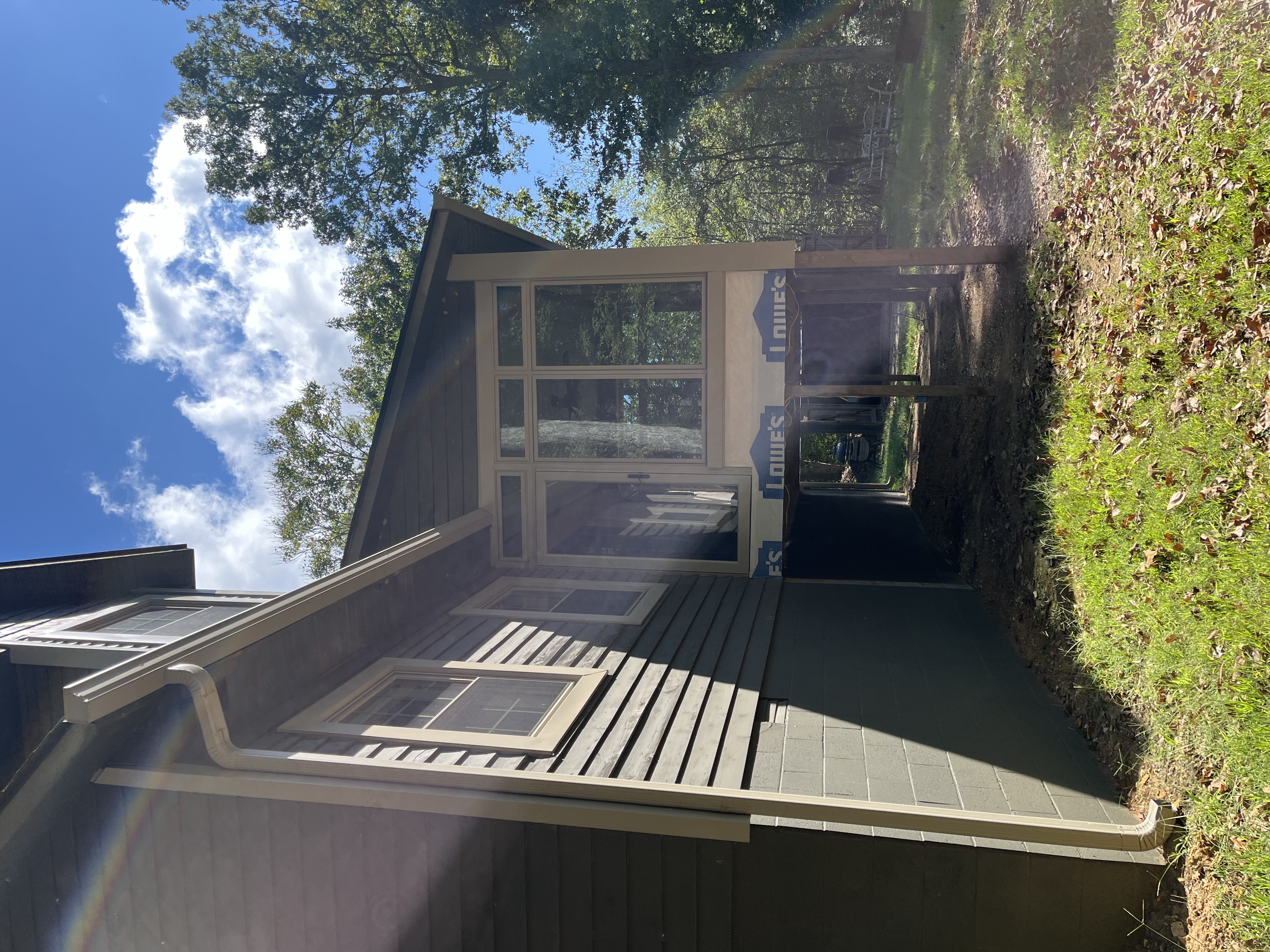 custom vinyl windows and glass door on sunroom