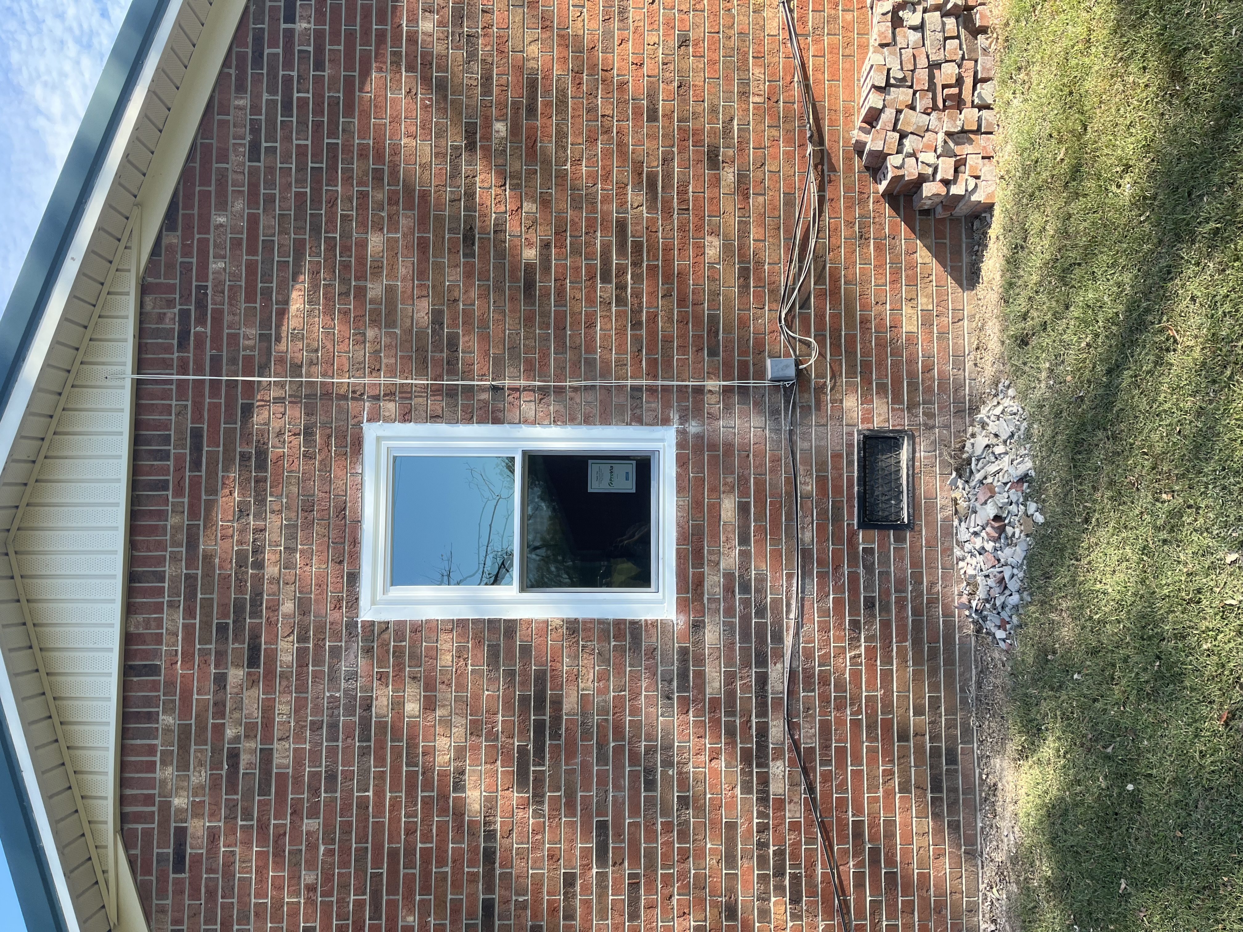 new vinyl window on house