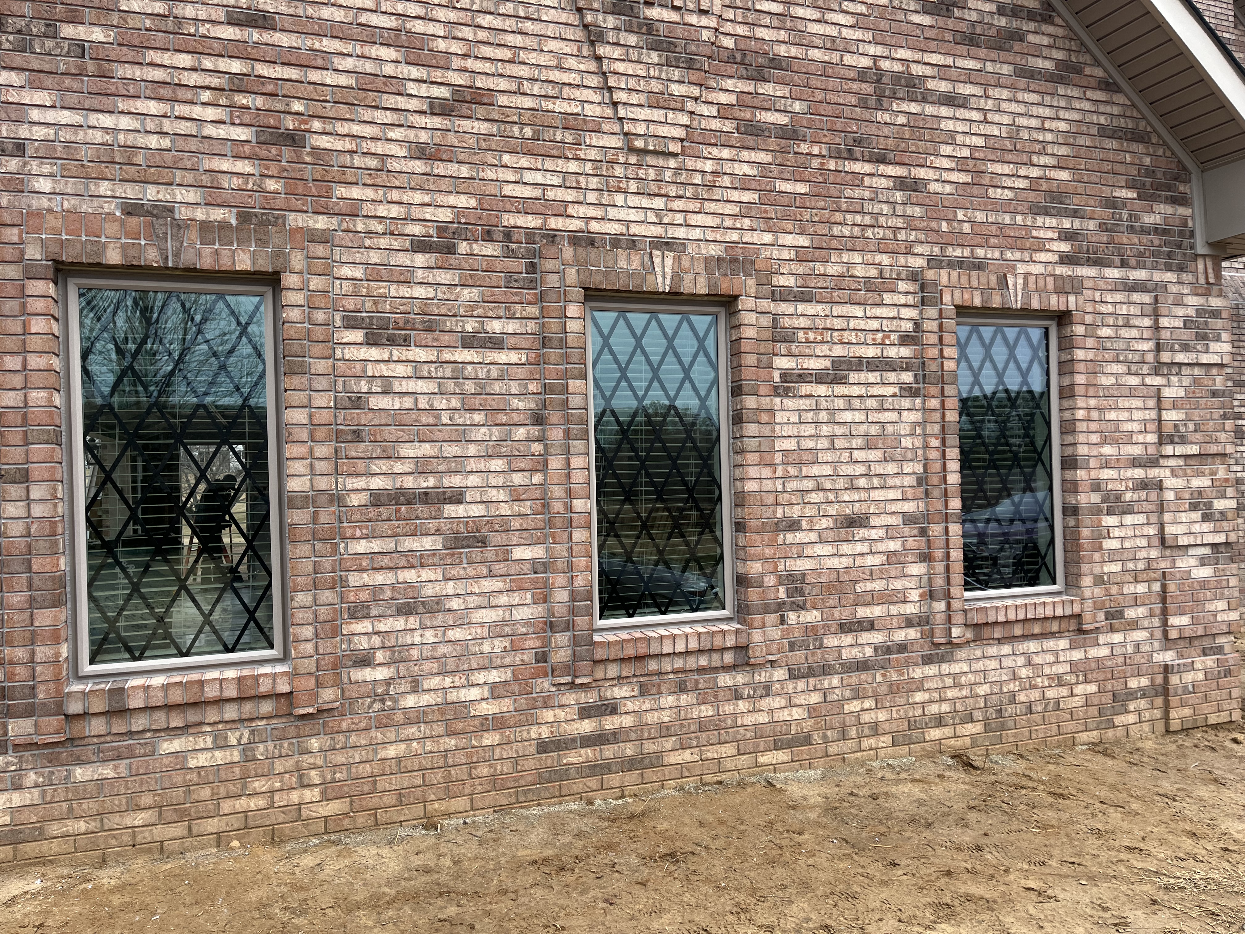 brick home with custom vinyl windows