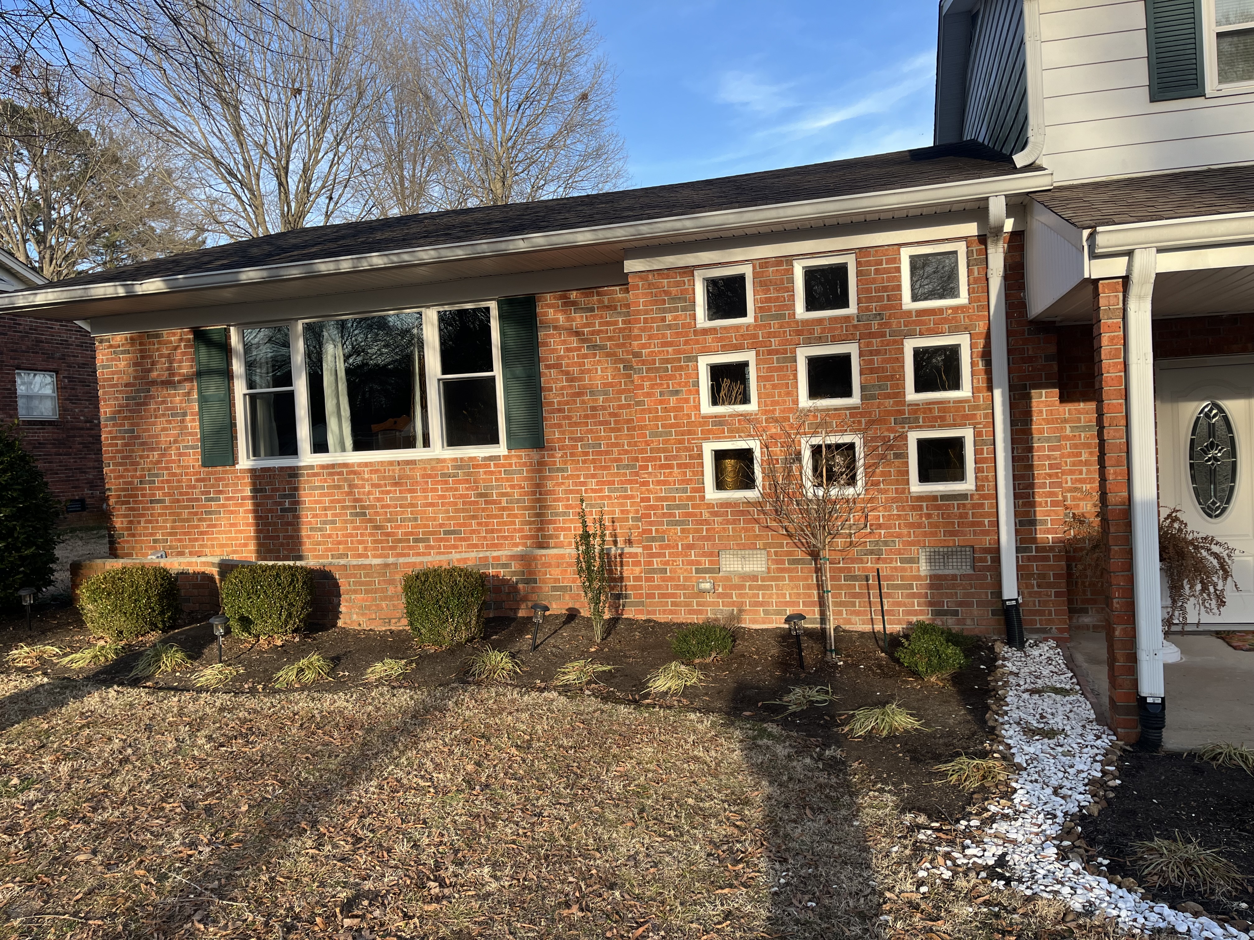 unique vinyl window installation on home