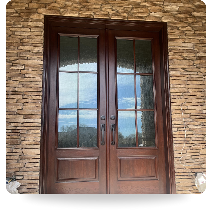 double wooden front doors with large windows